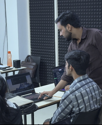 Expert mentor providing one-on-one practical training to a student at Adwoks Academy Jaipur